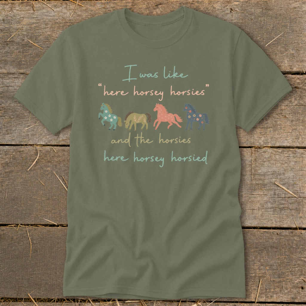 Olive t-shirt with four cartoon horses and text reading "I was like 'here horsey horsies' and the horsies here horsey horsied."
