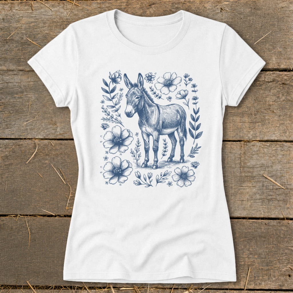White t-shirt with a blue pencil sketch of a donkey surrounded by flowers.