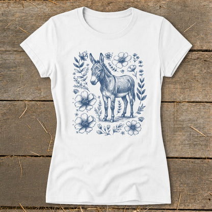 White t-shirt with a blue pencil sketch of a donkey surrounded by flowers.