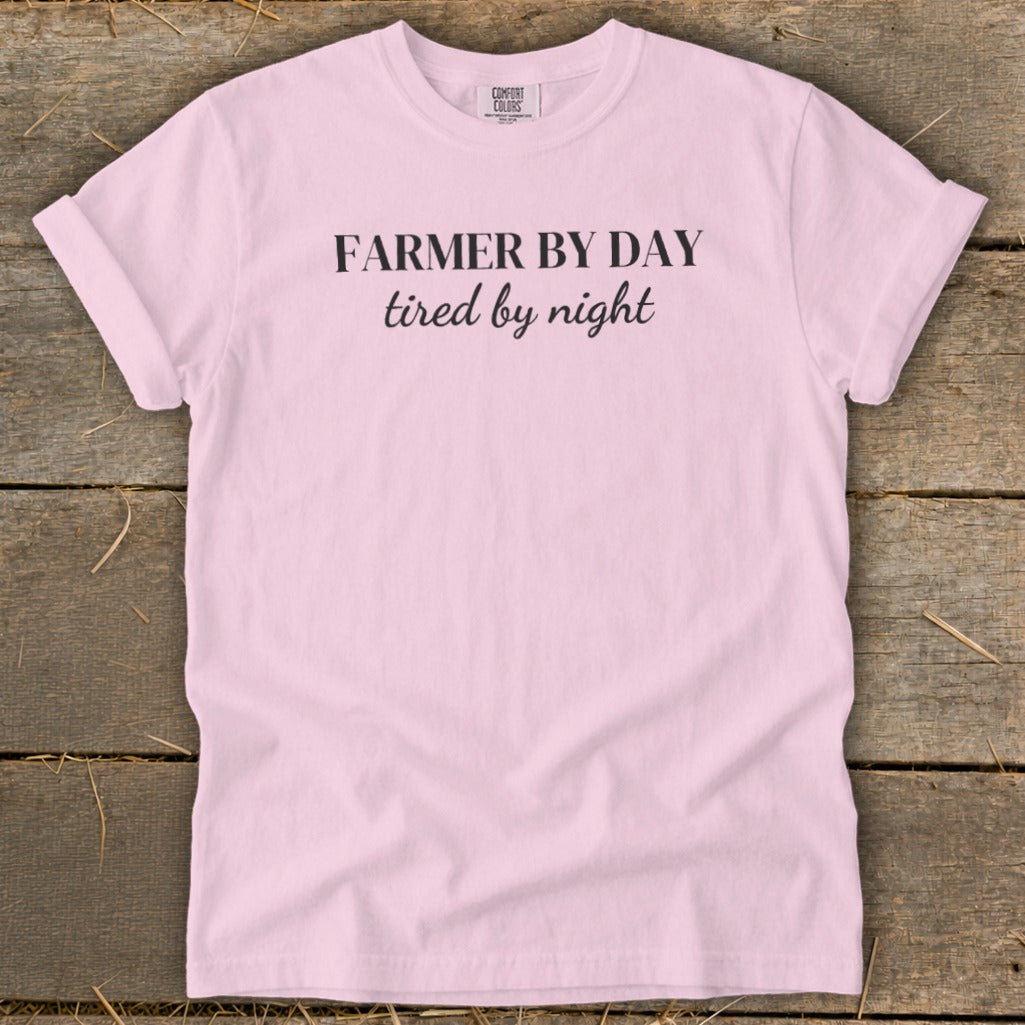 Light pink t-shirt with black text "FARMER BY DAY tired by night"