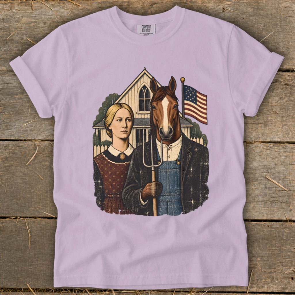 A light purple t-shirt featuring a parody American Gothic graphic with a horse-headed farmer holding a pitchfork.