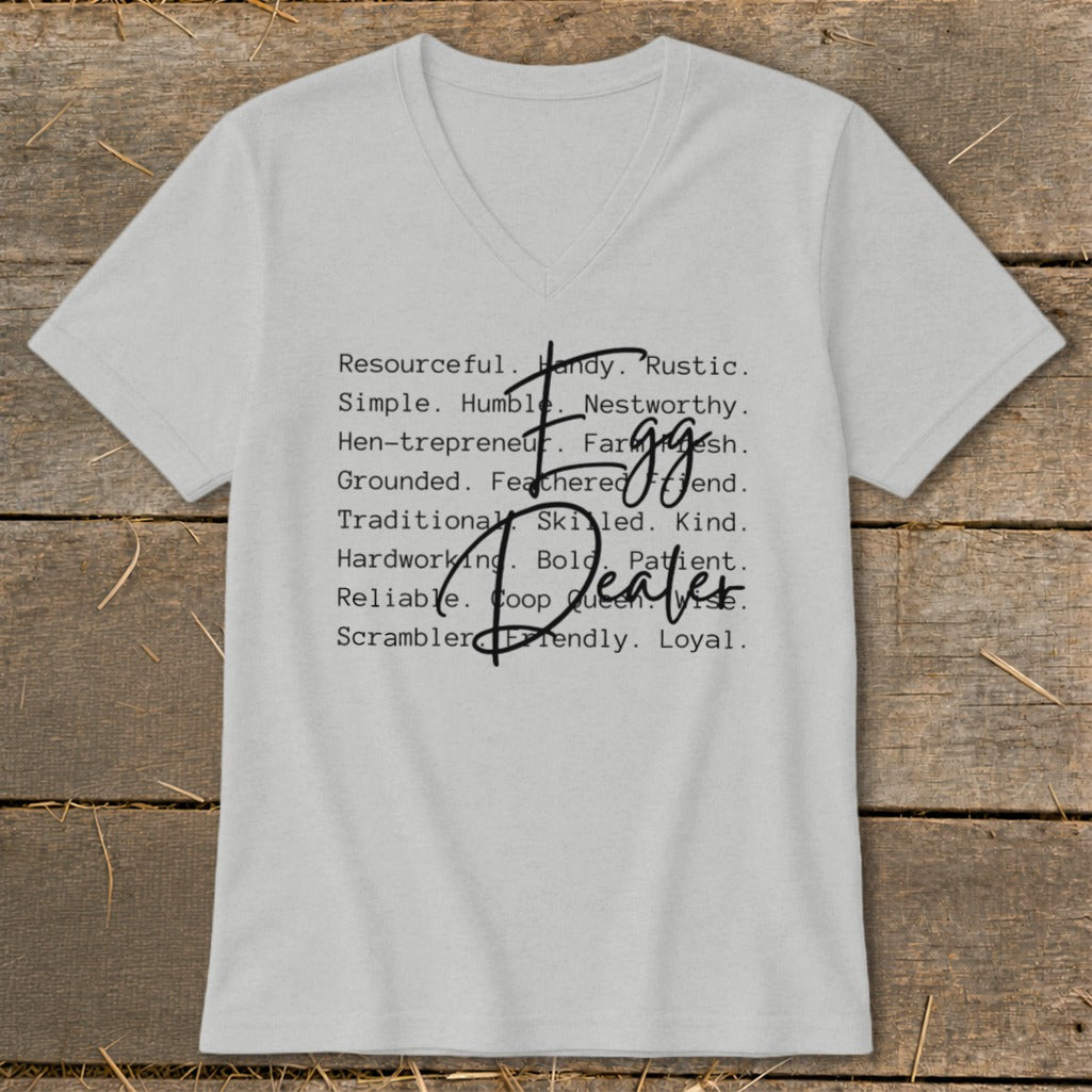 Light grey v-neck t-shirt with "Egg Dealer" in stylized text and descriptive words.