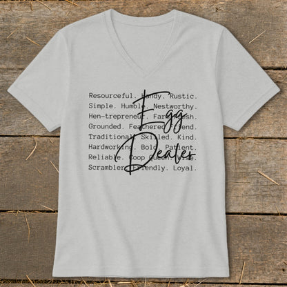 Light grey v-neck t-shirt with "Egg Dealer" in stylized text and descriptive words.