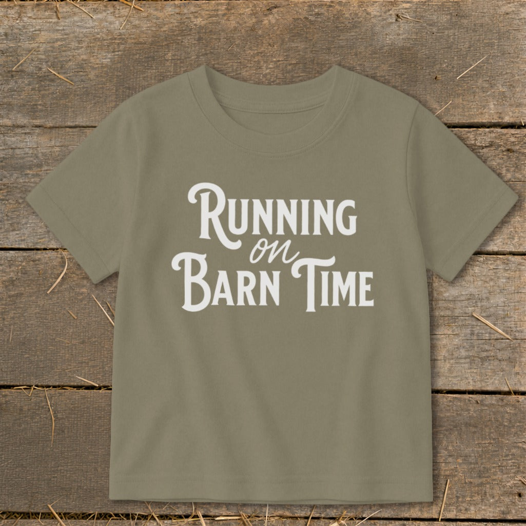 Green t-shirt with white text "Running on Barn Time".