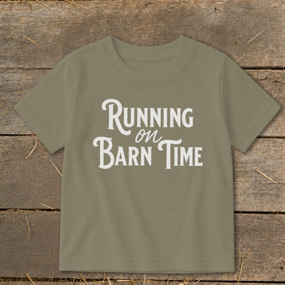 Green t-shirt with white text "Running on Barn Time".