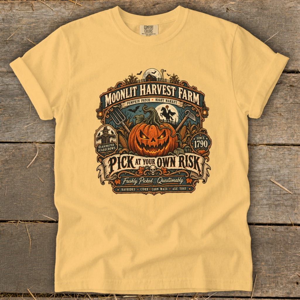 Moonlit Harvest Farm t-shirt with jack-o-lantern, scarecrows, and "Pick at Your Own Risk" text.