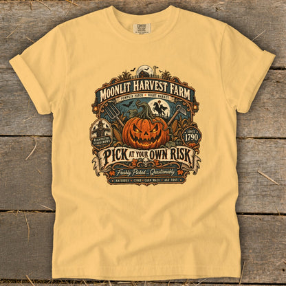 Moonlit Harvest Farm t-shirt with jack-o-lantern, scarecrows, and "Pick at Your Own Risk" text.