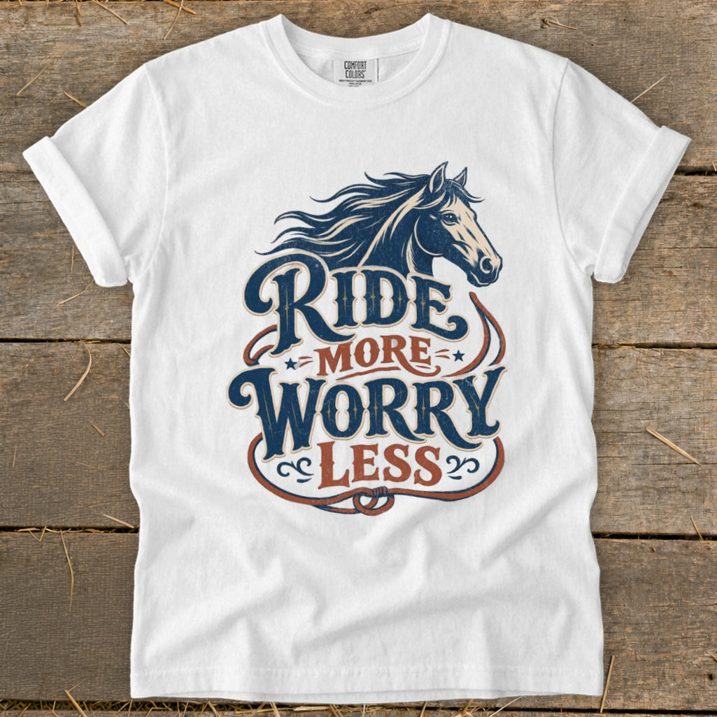 White t-shirt with "Ride More Worry Less" text and a horse graphic.