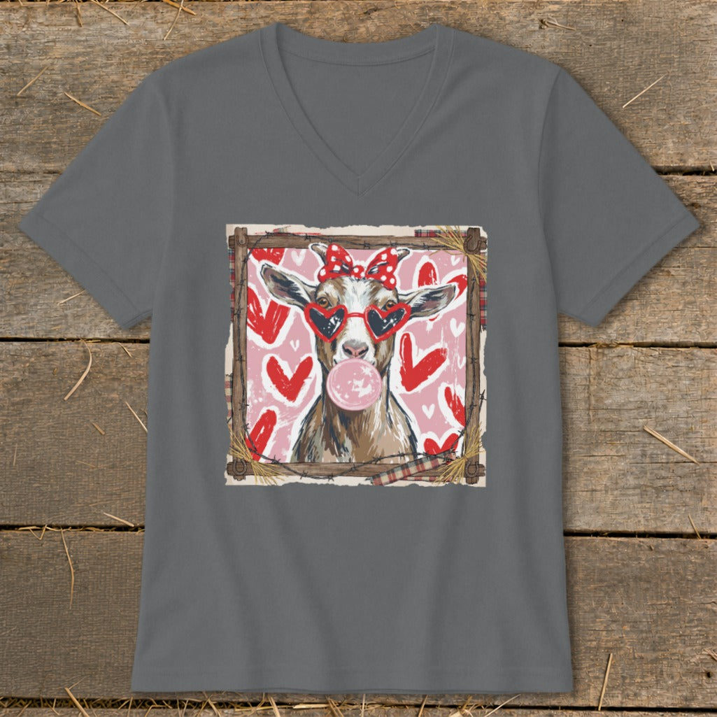 Goat wearing heart sunglasses and bow blows bubblegum, surrounded by hearts.