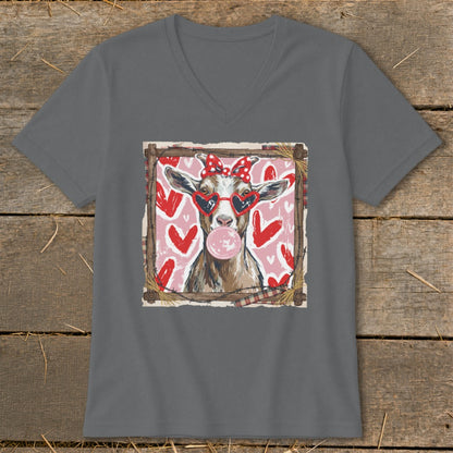 Goat wearing heart sunglasses and bow blows bubblegum, surrounded by hearts.