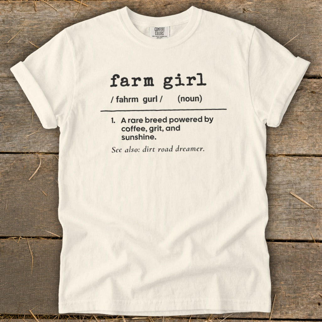 White t-shirt with "farm girl" definition and "dirt road dreamer" phrase.
