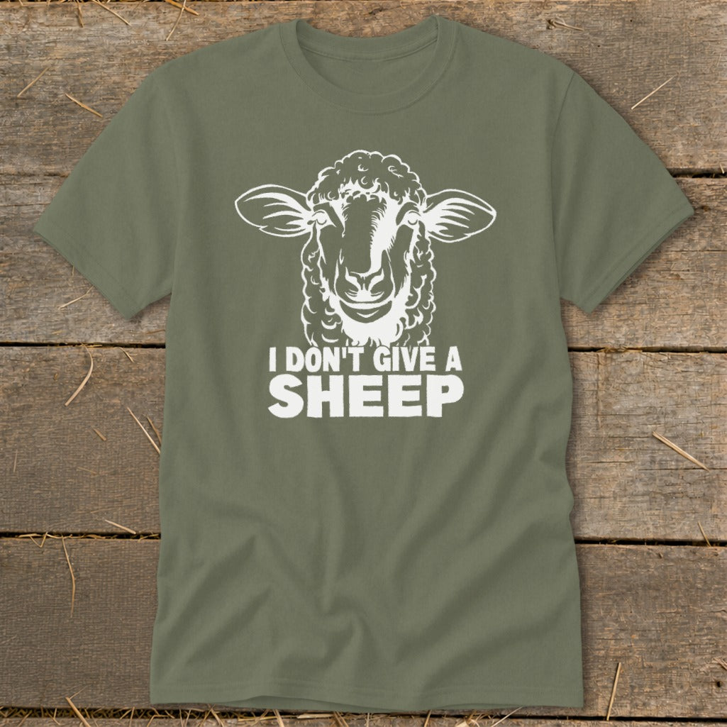 Olive green t-shirt with white graphic of sheep face and text "I DON'T GIVE A SHEEP".