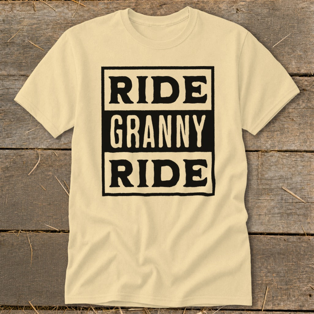 Light yellow t-shirt with black text "RIDE GRANNY RIDE" in three stacked boxes.