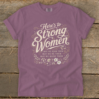 Mauve t-shirt with "Here's to Strong Women" text and motivational phrases.