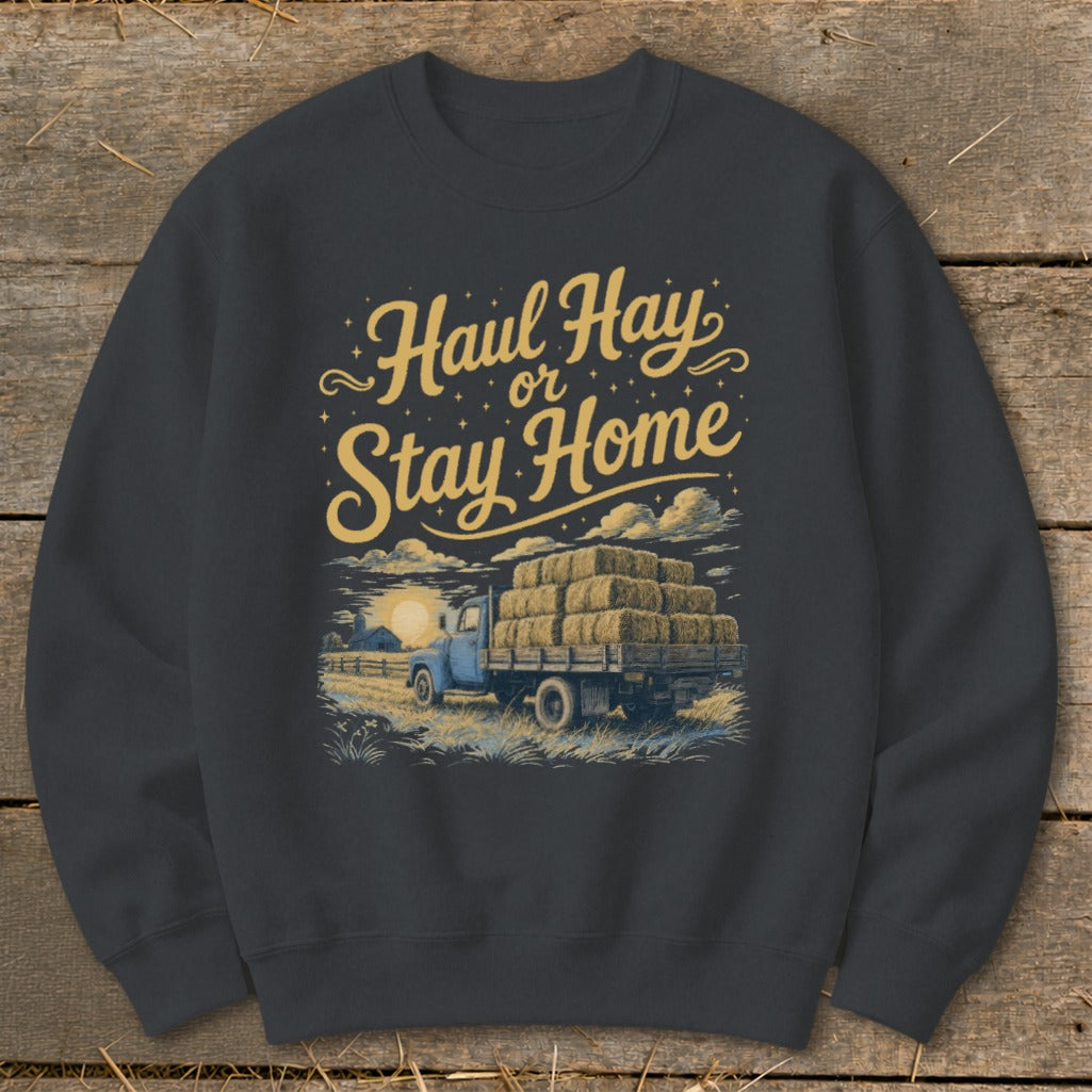 "Haul Hay or Stay Home" graphic on a dark grey crewneck sweatshirt with a vintage truck.