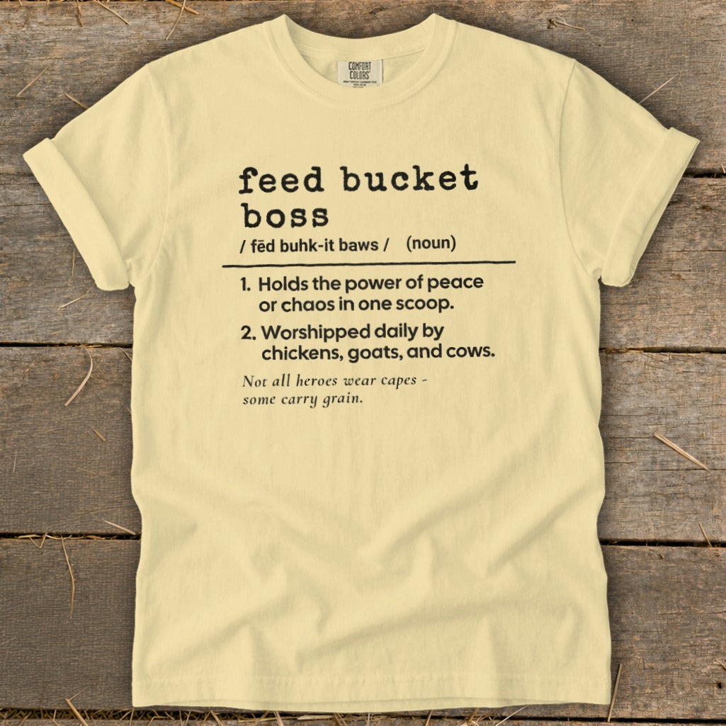Pale yellow t-shirt with "feed bucket boss" definition and farm animal humor.
