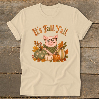 Pig wearing glasses and bandana surrounded by pumpkins and fall leaves, text "It's Fall Y'all".