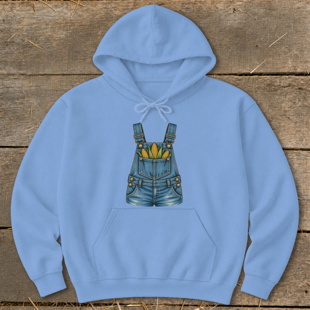 Light blue hoodie with a graphic of denim overalls filled with corn on the cob.