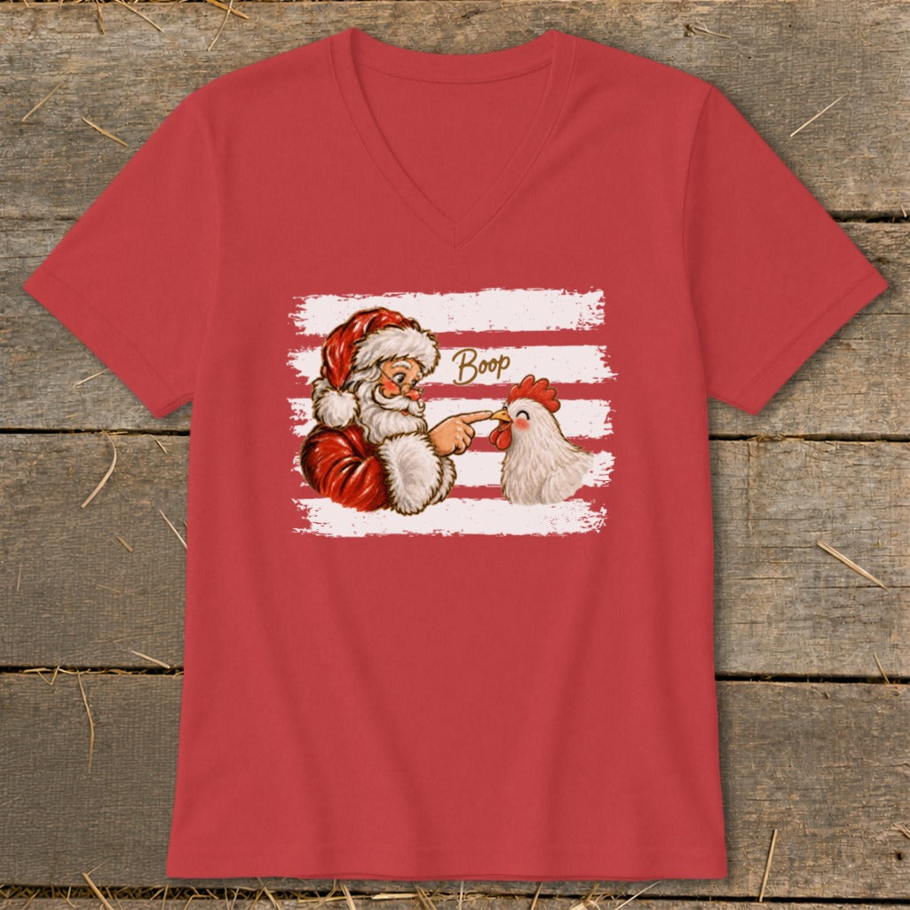 Santa booping a chicken on the nose, with "Boop" text.