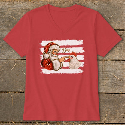 Santa booping a chicken on the nose, with "Boop" text.