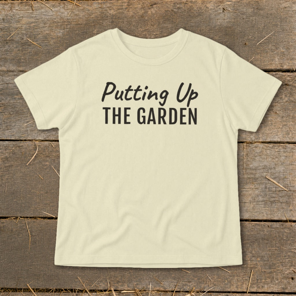 Cream t-shirt with black text reading "Putting Up THE GARDEN".