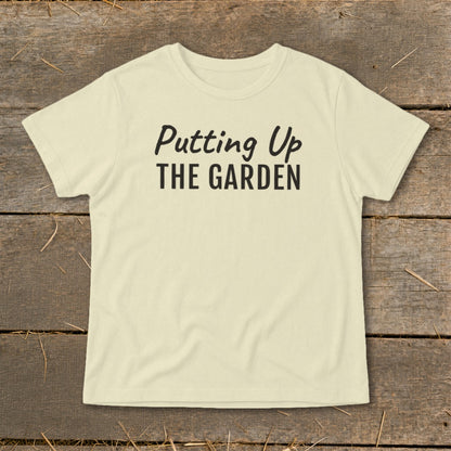 Cream t-shirt with black text reading "Putting Up THE GARDEN".