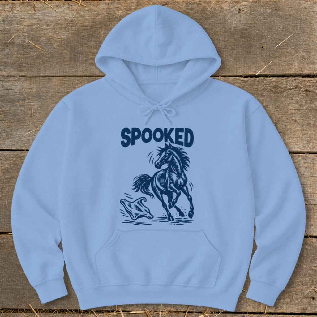 Light blue hoodie with "SPOOKED" text above a startled horse and ghost graphic.