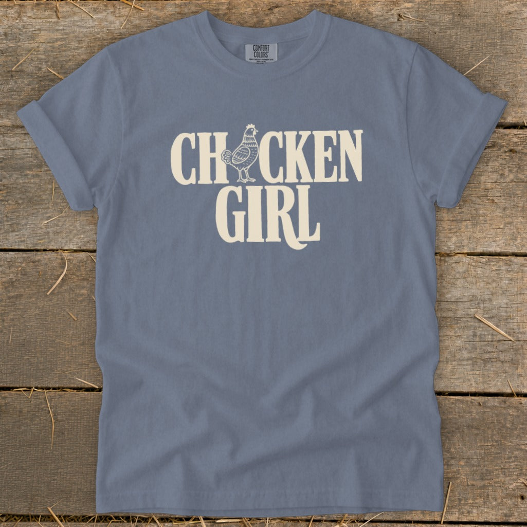Blue t-shirt with "Chicken Girl" text and a chicken graphic.