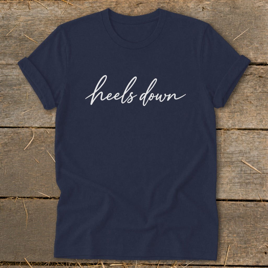 Navy t-shirt with white "heels down" text in script font.