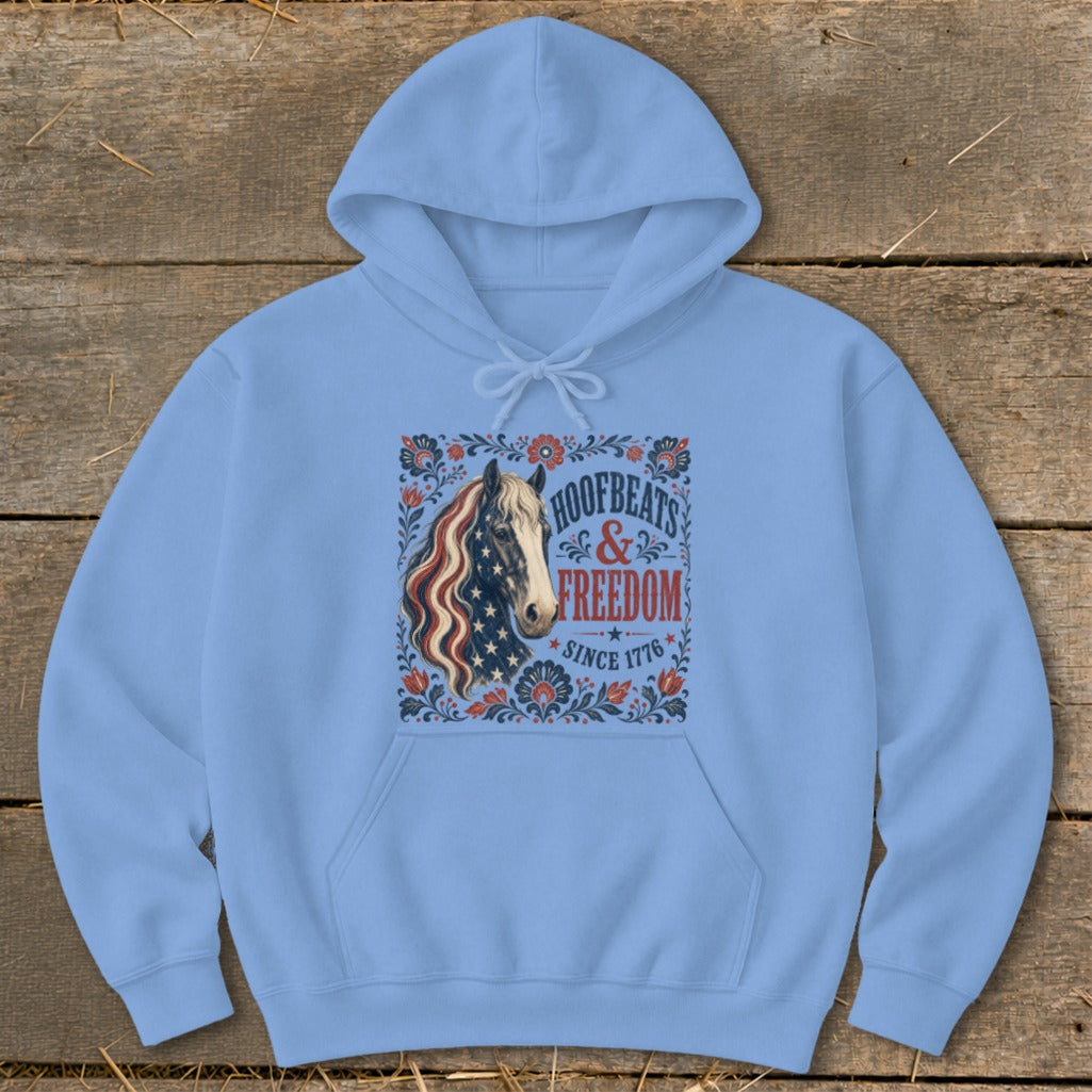 Light blue hoodie with horse and American flag design reading "Hoofbeats & Freedom Since 1776".