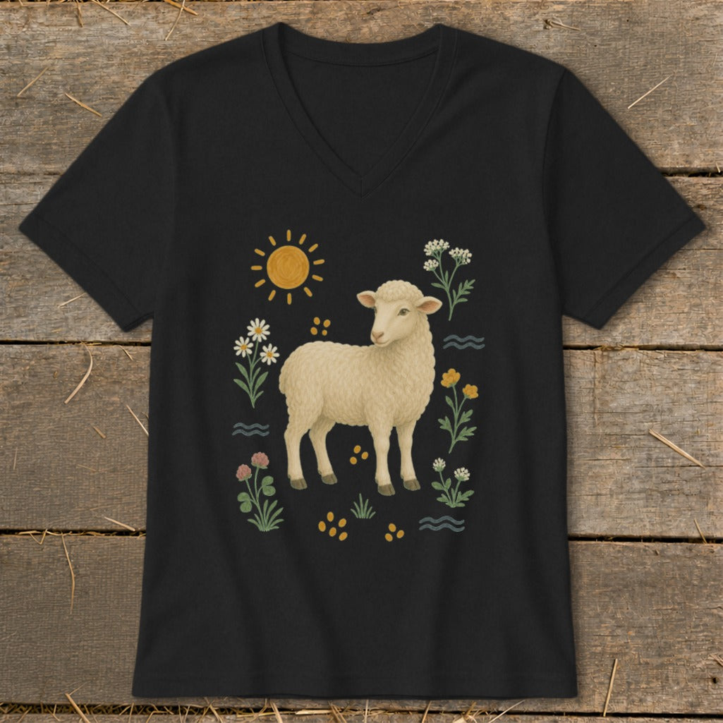 Black t-shirt with a cream sheep illustration surrounded by flowers and a sun.