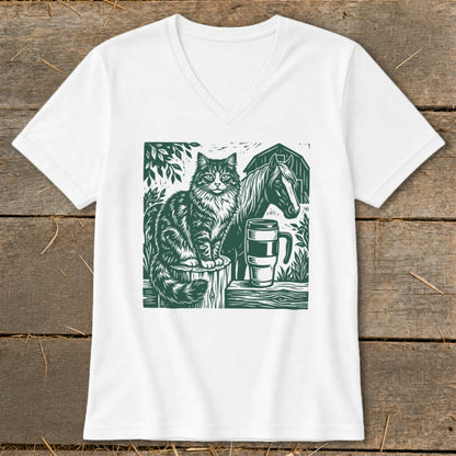 White v-neck t-shirt with a green linocut-style graphic of a cat, horse, and barn.