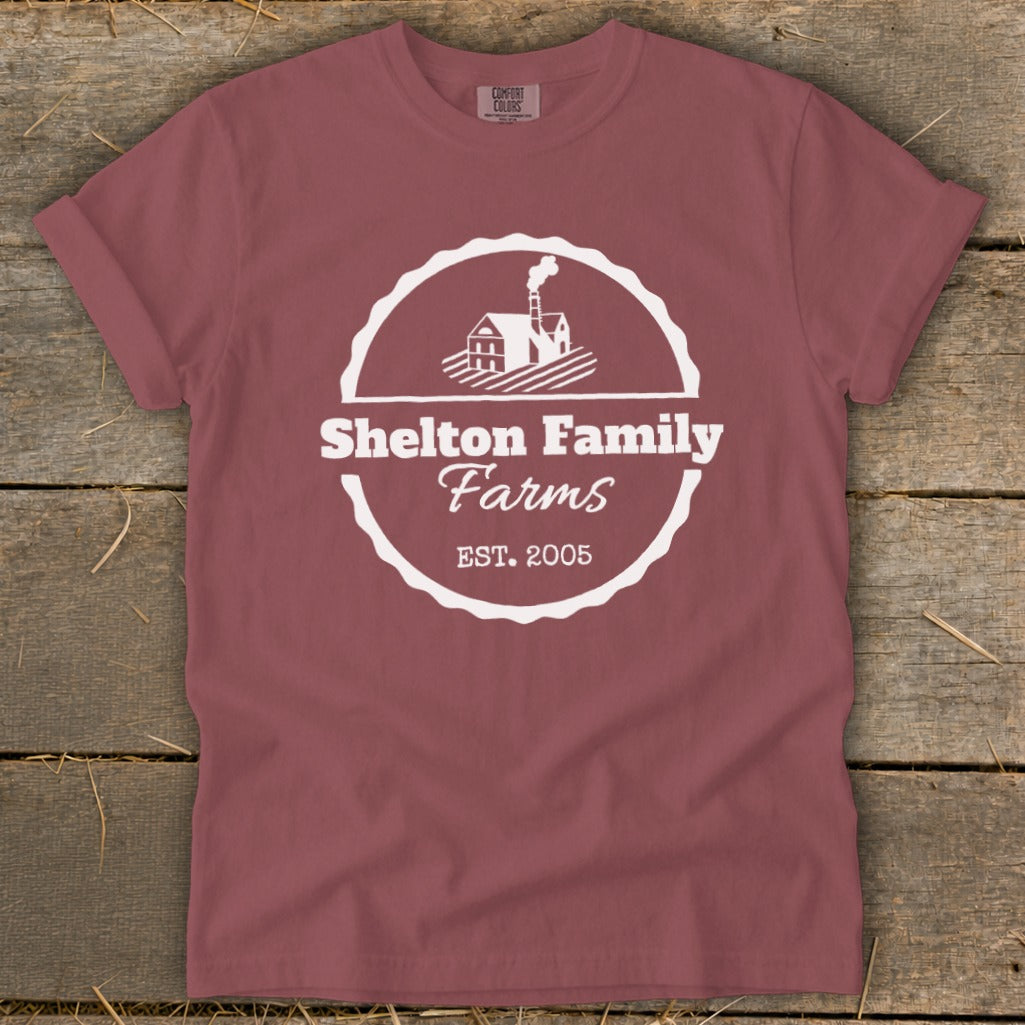 Maroon t-shirt with white Shelton Family Farms logo and established date.
