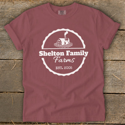 Maroon t-shirt with white Shelton Family Farms logo and established date.