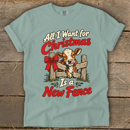 T-shirt with cow and fence graphic, "All I Want for Christmas Is a New Fence" text.