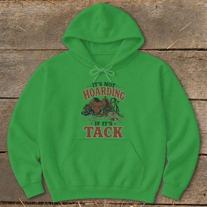Green hoodie with "It's Not Hoarding If It's Tack" text and equestrian tack graphic.