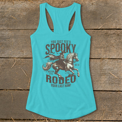 Turquoise tank top with "Spooky Rodeo" design featuring a cowboy on a horse.
