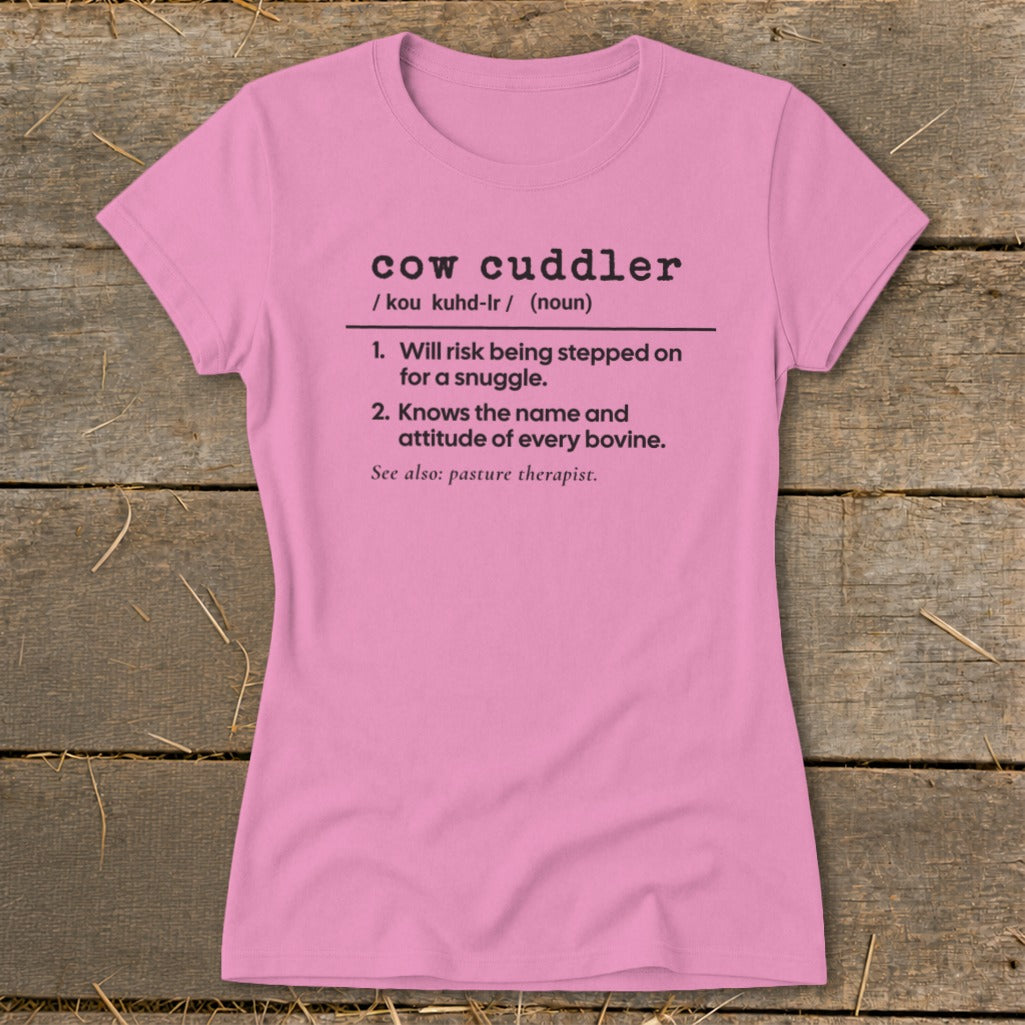 Pink t-shirt with "cow cuddler" definition printed in black text.