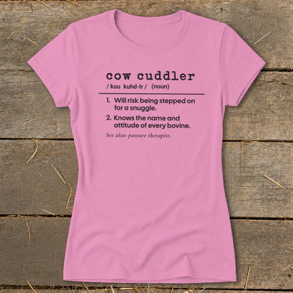 Pink t-shirt with "cow cuddler" definition printed in black text.