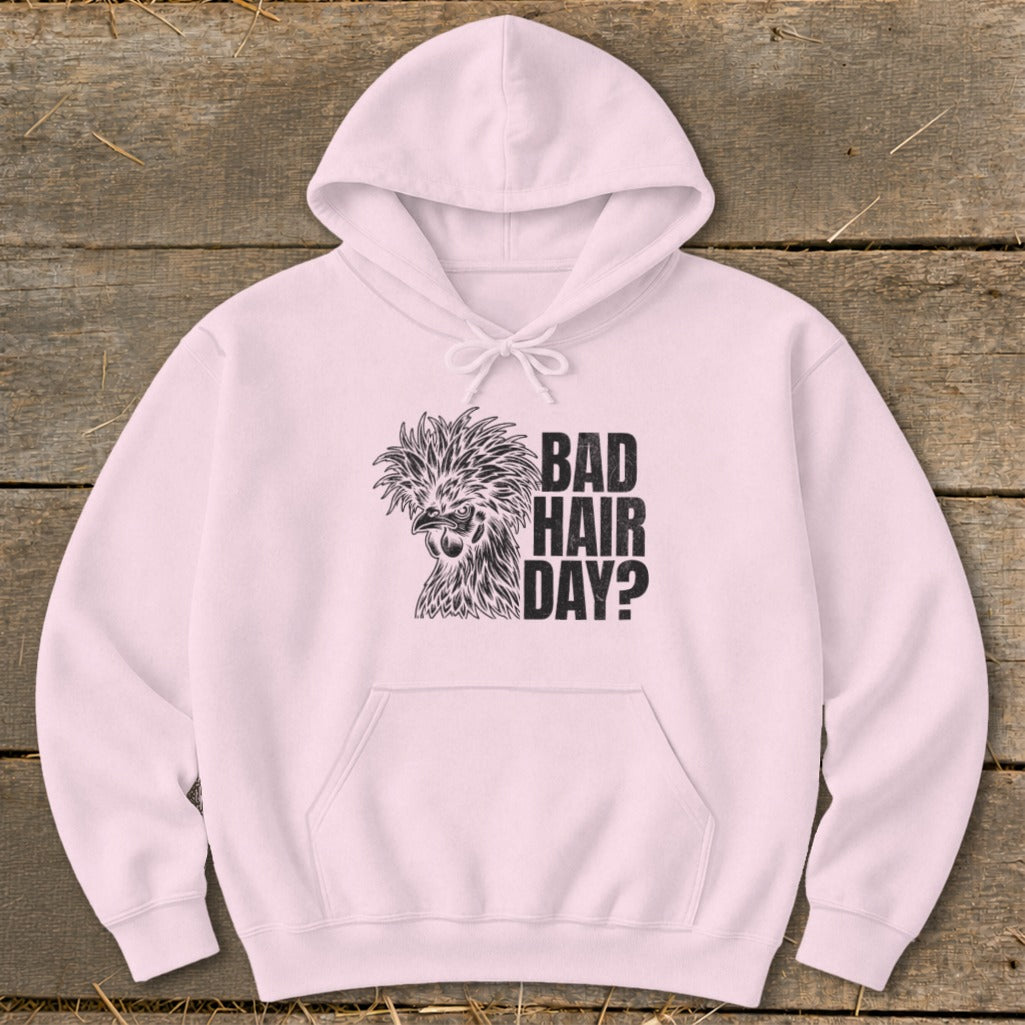 Pink hoodie with a black graphic of a fancy chicken and text reading "BAD HAIR DAY?".