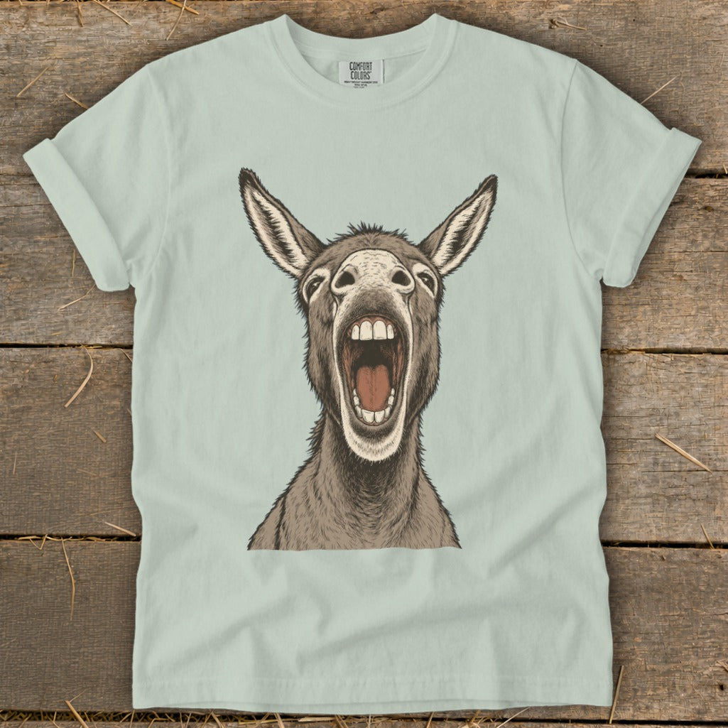 Light blue t-shirt with a graphic of a donkey's head with its mouth open wide.