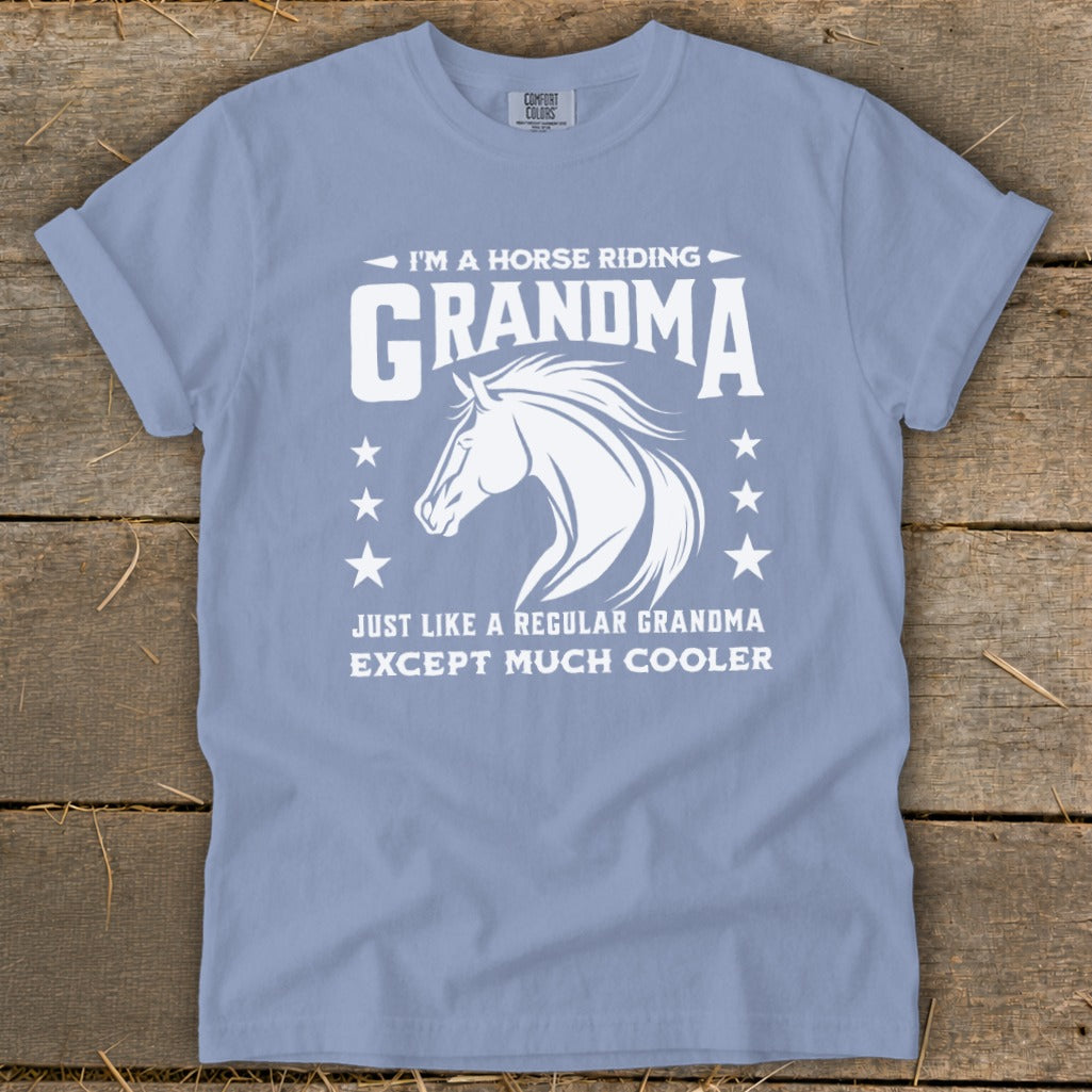Light blue t-shirt with white text and horse graphic: "I'm a horse riding Grandma. Just like a regular Grandma except much cooler."