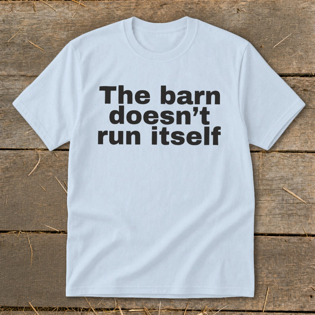 Light blue t-shirt with black text reading "The barn doesn't run itself".