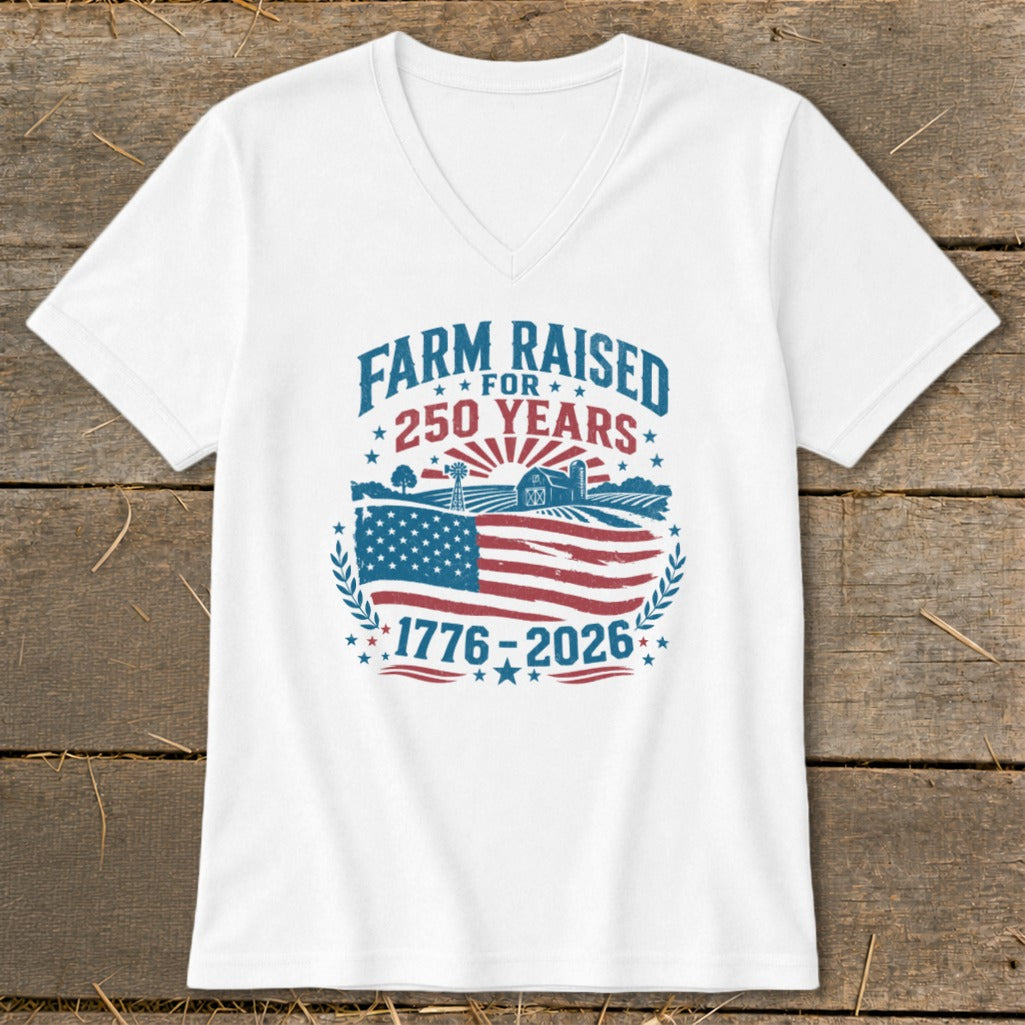 White v-neck shirt with "Farm Raised for 250 Years" graphic and American flag.