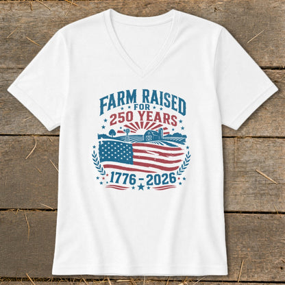 White v-neck shirt with "Farm Raised for 250 Years" graphic and American flag.