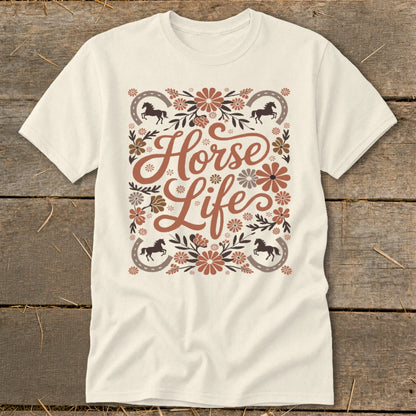 Cream t-shirt with "Horse Life" text surrounded by floral and horseshoe graphics.