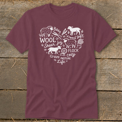 Maroon t-shirt with white heart-shaped graphic of sheep, wool, and farm words.