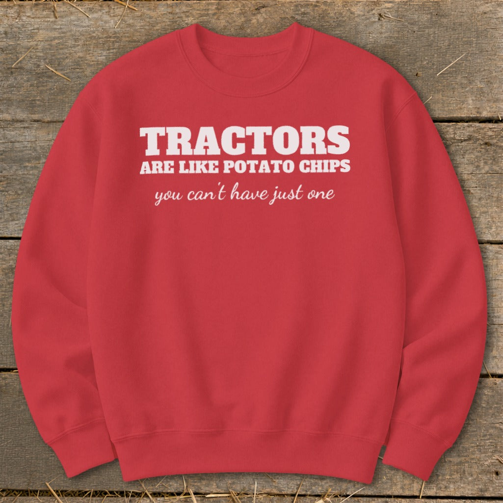 Red sweatshirt with white text "Tractors are like potato chips, you can't have just one."