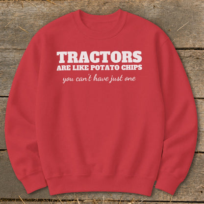 Red sweatshirt with white text "Tractors are like potato chips, you can't have just one."