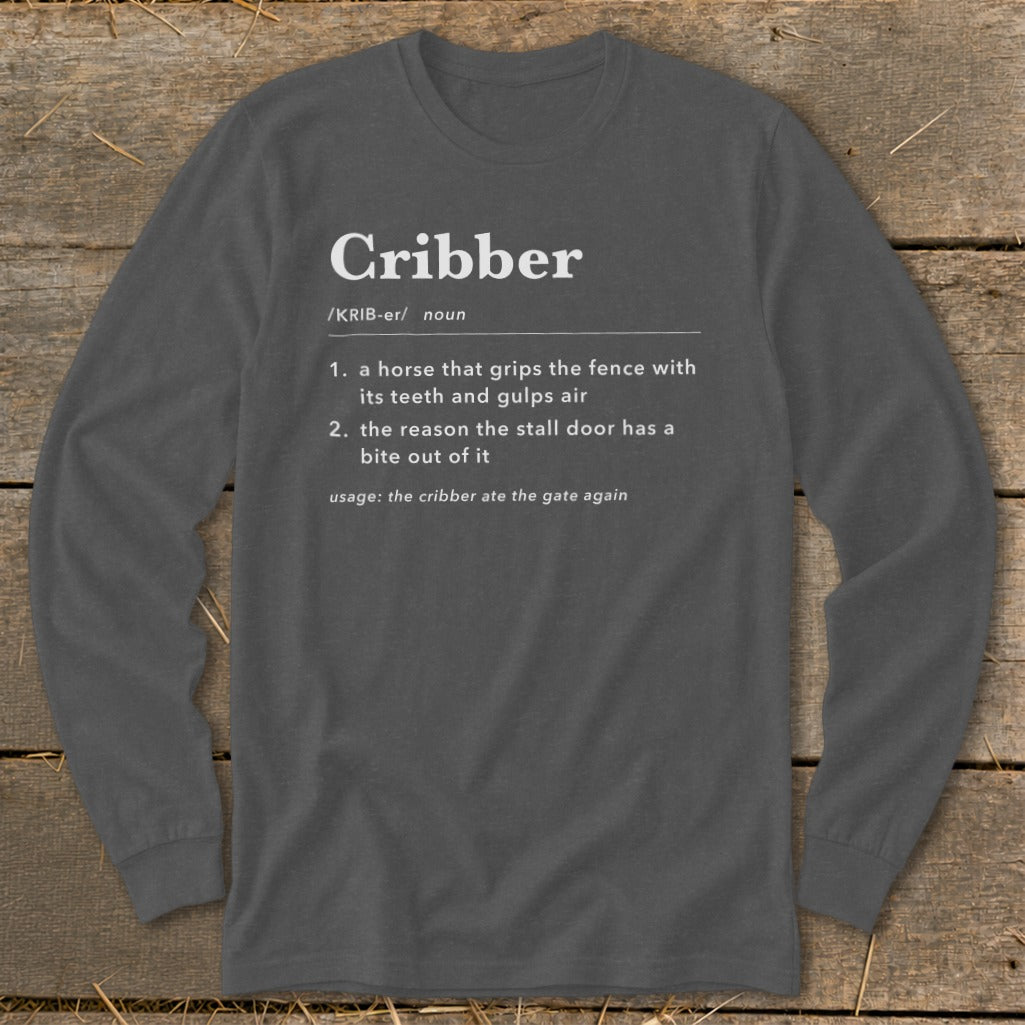 Dark gray long-sleeve t-shirt with white text defining the word cribber in dictionary style.